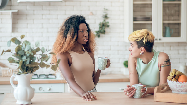 Couple has discussion over coffee