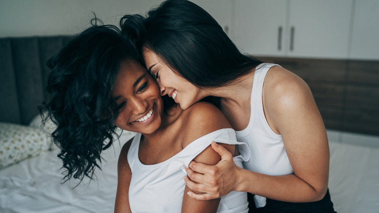 two girls on a bed