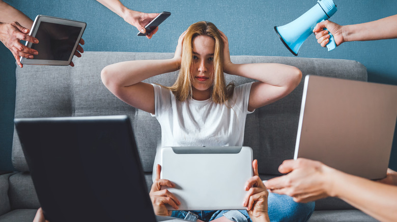 woman surrounded by media devices