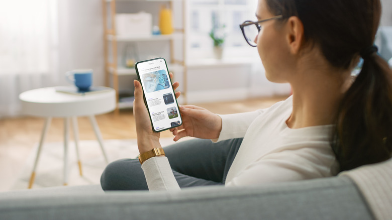 woman reading news on phone