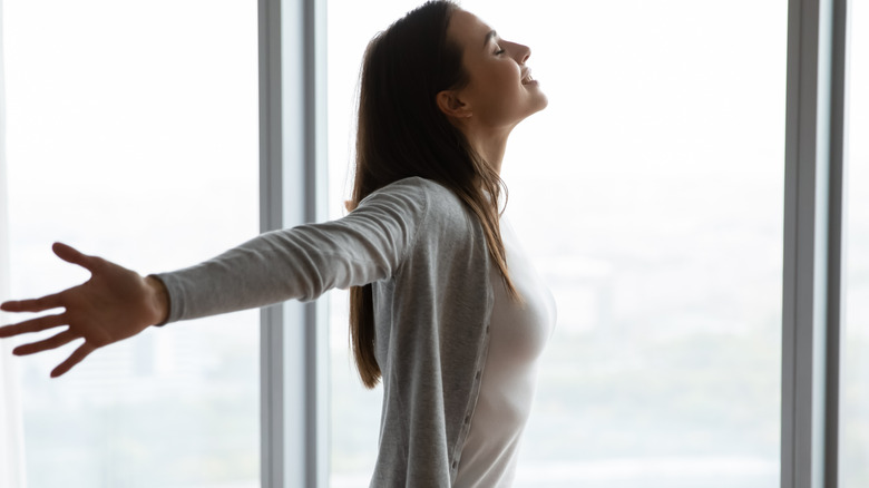 woman smiling with big windows