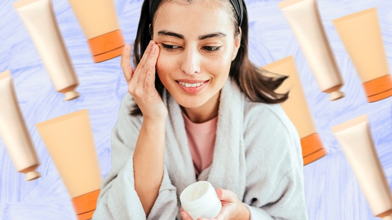 A woman applying cream