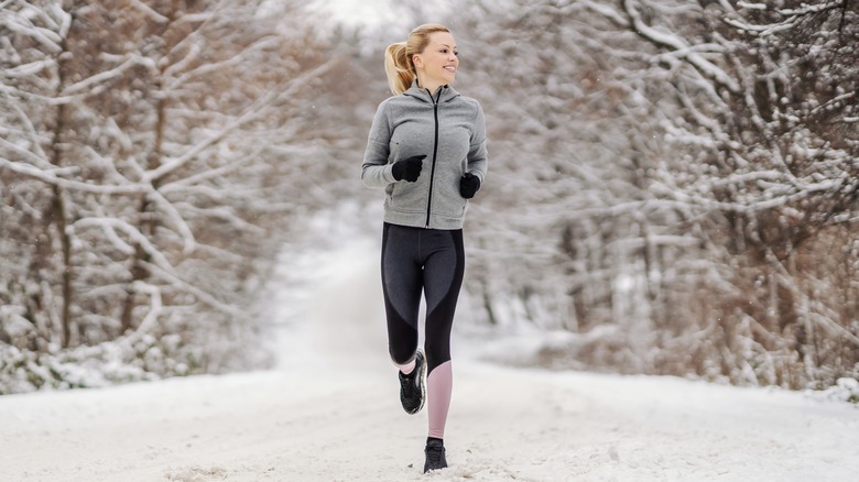 Woman running in the cold 