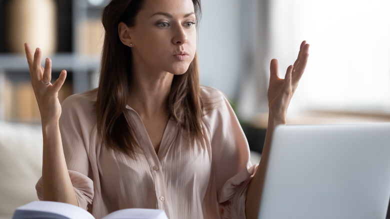 Stressed woman with laptop