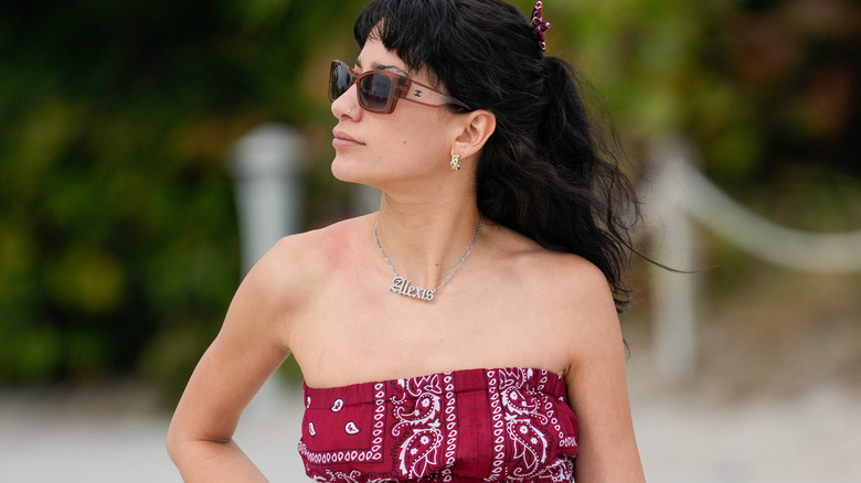 Woman wearing lots of jewelry at the beach