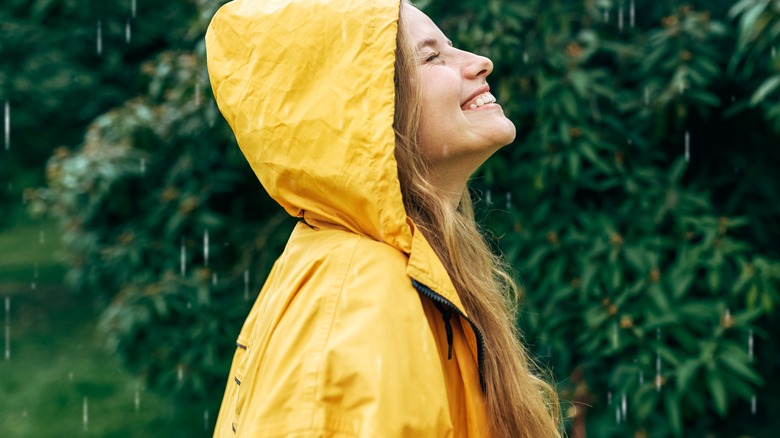 female in yellow raincoat