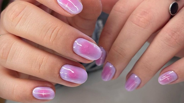 Pink aura nail manicure