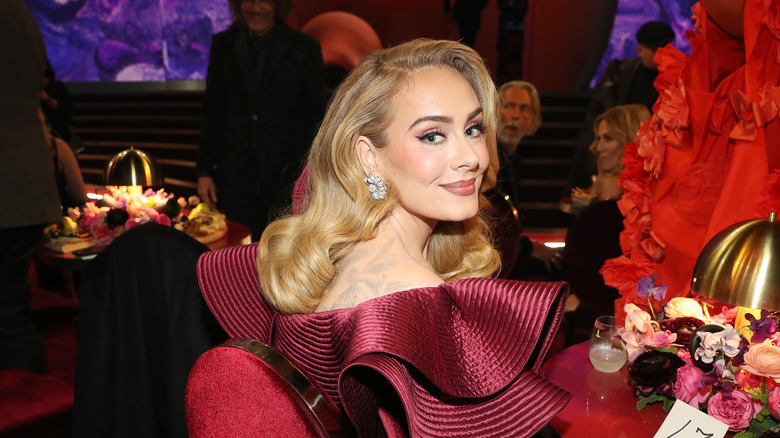 Adele smiling with retro wavy hairstyle