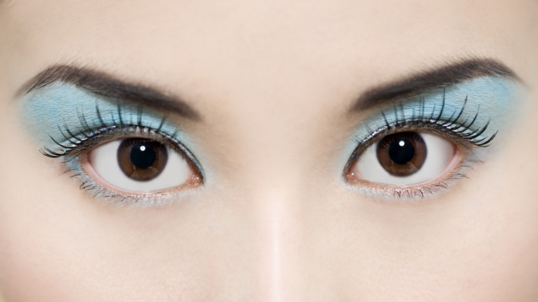 woman wearing blue eyeshadow