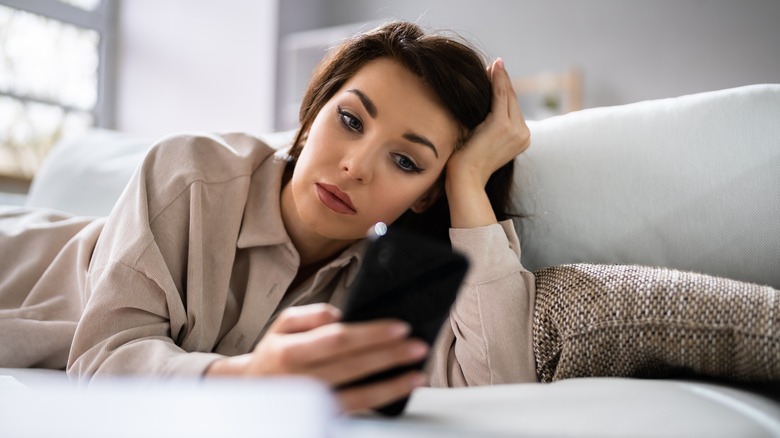 woman looking at her phone