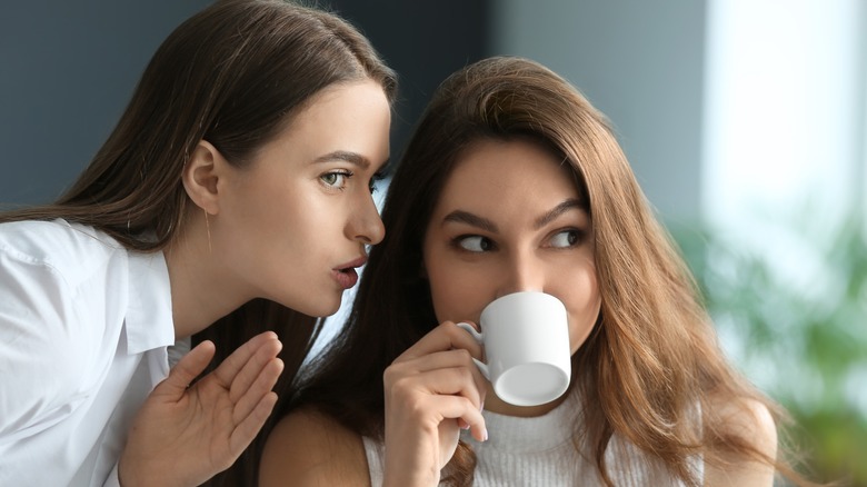 Two women gossiping