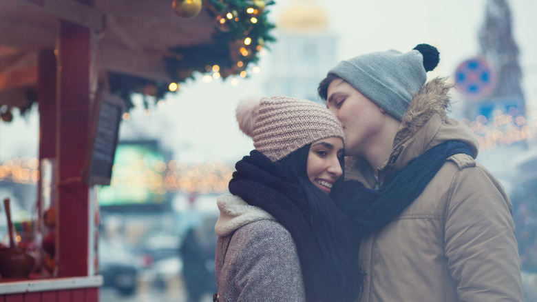 Couple hugging on street