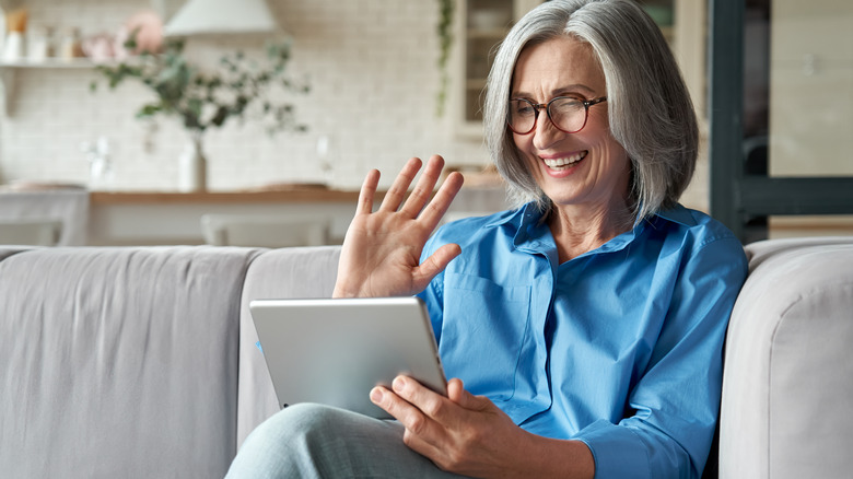 woman waving at friend online