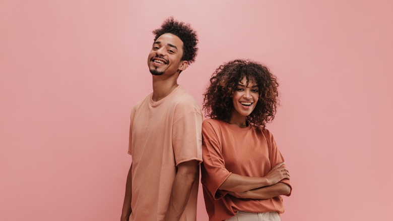 couple in front of pink