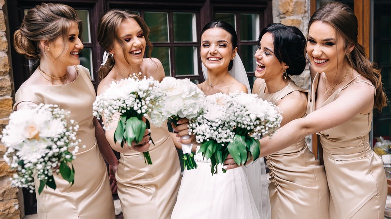 Bride poses with bridesmaids