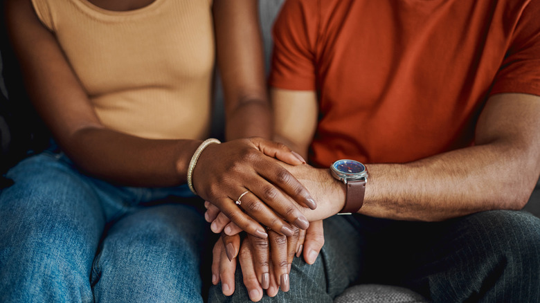 Couple speaking with doctor