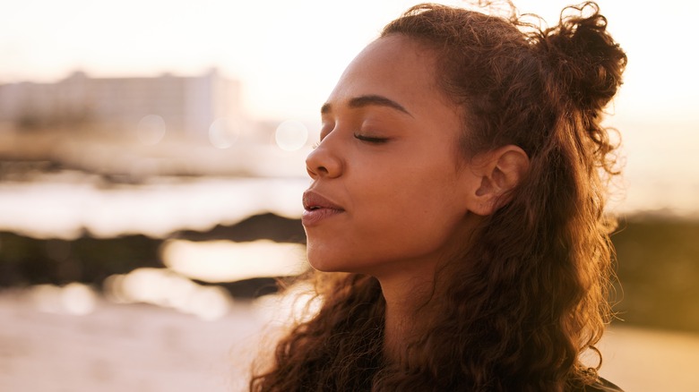 woman meditating outside