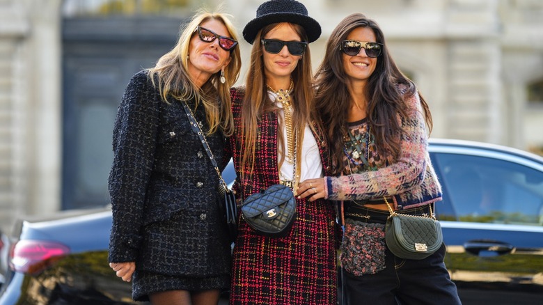 Women in matching plaid sets