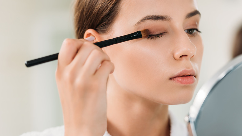 applying eye makeup on monolids