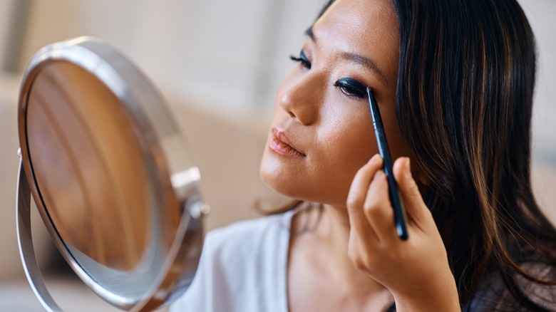 Woman applying eyeshadow 