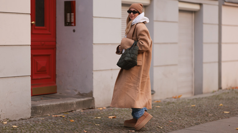 woman wearing oversized coat