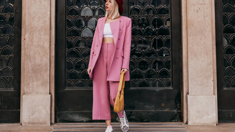 Woman with pink pantsuit