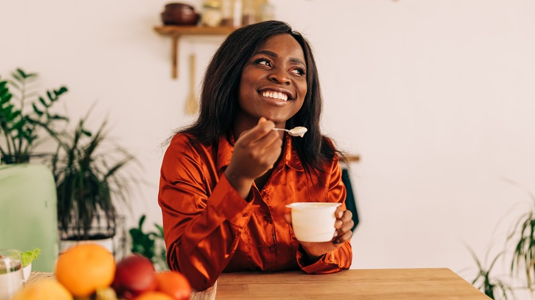 woman eating yogurt