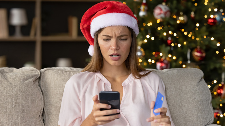 stressed woman in Santa hat