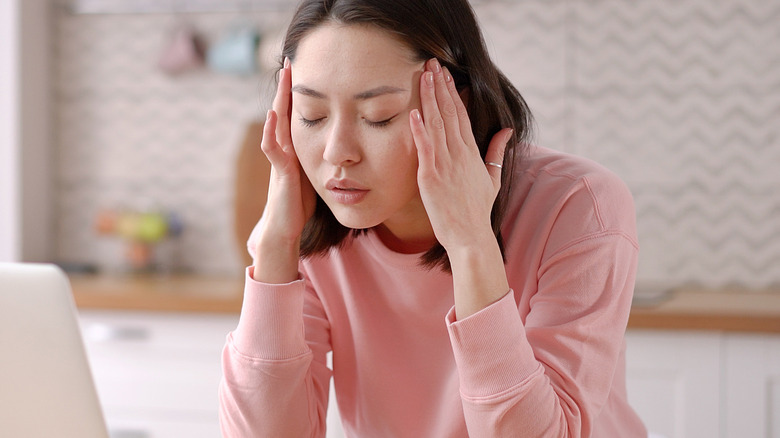 A woman stressed at work