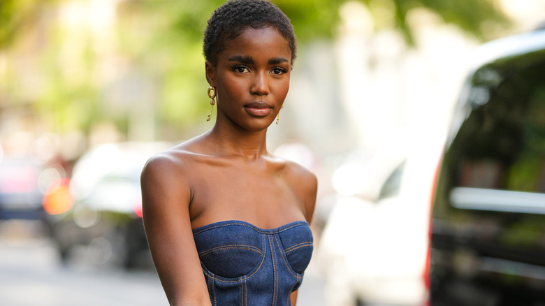 Woman wearing a denim corset top 