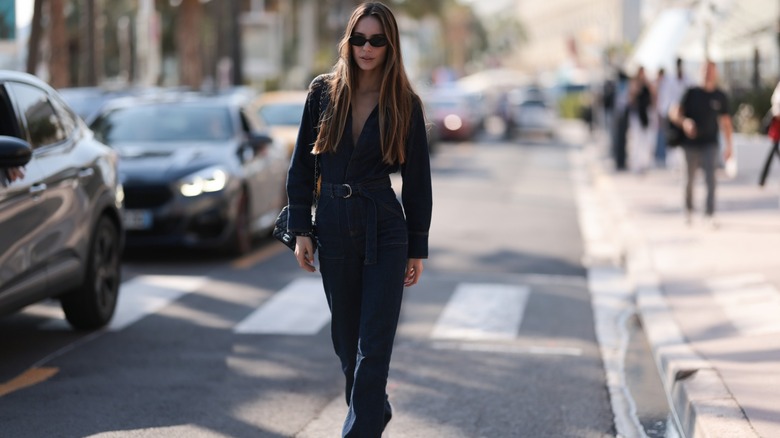 woman wearing denim jumpsuit