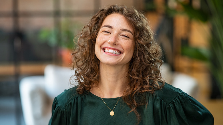 Smiling woman with curly hair