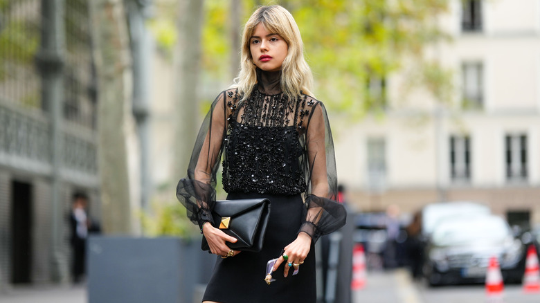 woman with black sequined top 