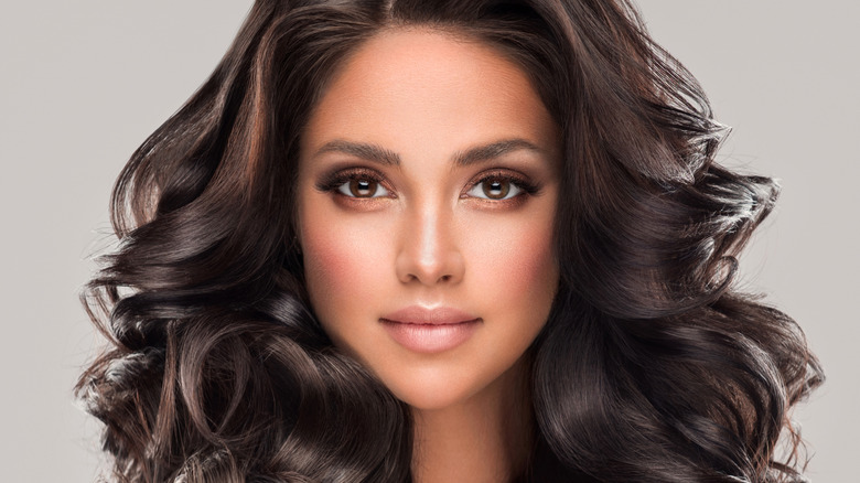 brunette woman with wavy hair