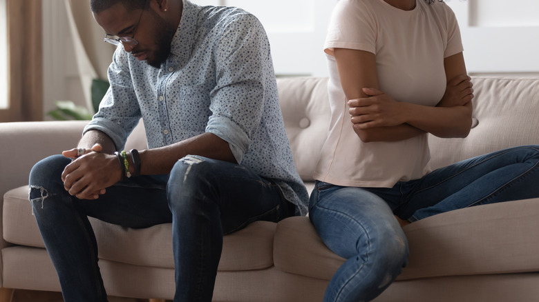 Upset couple facing away