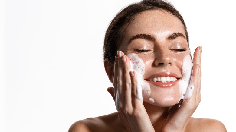 Woman washing face