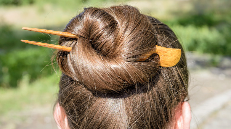 bun with wooden hair pin