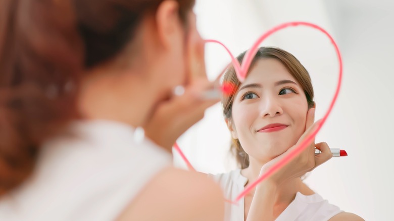 Woman looking at her reflection