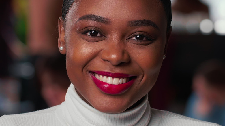 Woman with red lips smiling