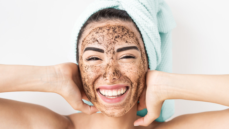 Woman with facial scrub