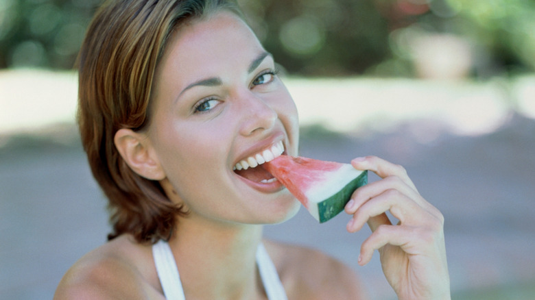 Woman eating watermelon