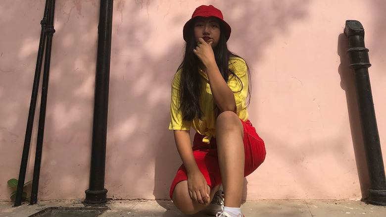 woman in red and yellow outfit