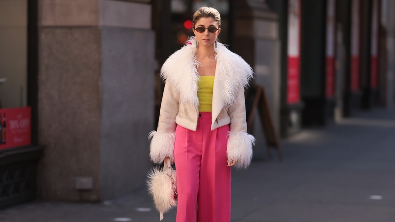 woman wearing tube top under fluffy coat