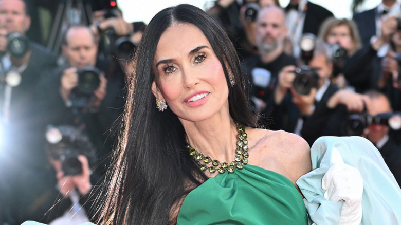 Demi Moore in an emerald green gown with her hair straight at Cannes Film Festival