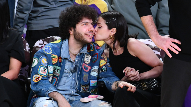 Selena Gomez leans to kiss Benny Blanco on the cheek