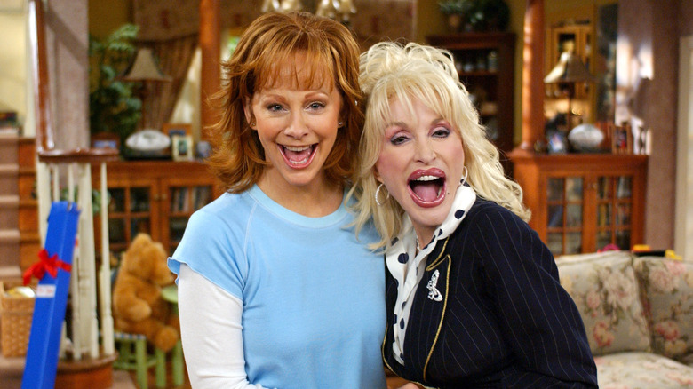 Reba McEntire and Dolly Parton laughing