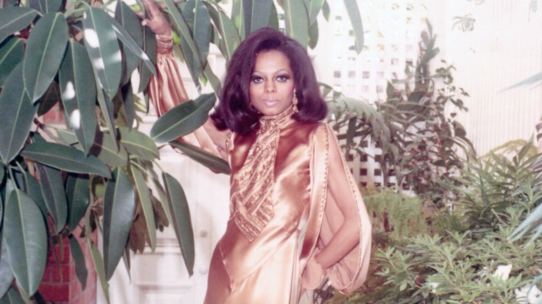 Diana Ross poses in a gold dress in 1970