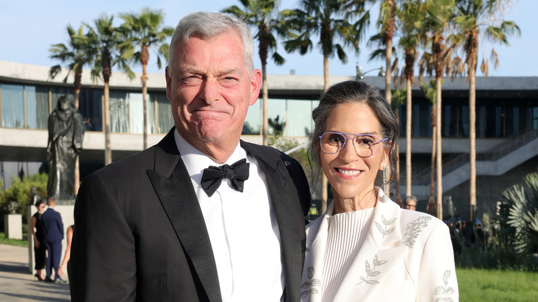 Jami Gertz posing for a photo with Antony Ressler at the LACMA's Opening Gala