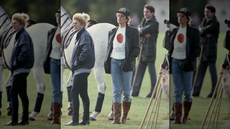 Diana, Princess of Wales wearing jeans and a T-shirt with brown boots and a black blazer on polo grounds.