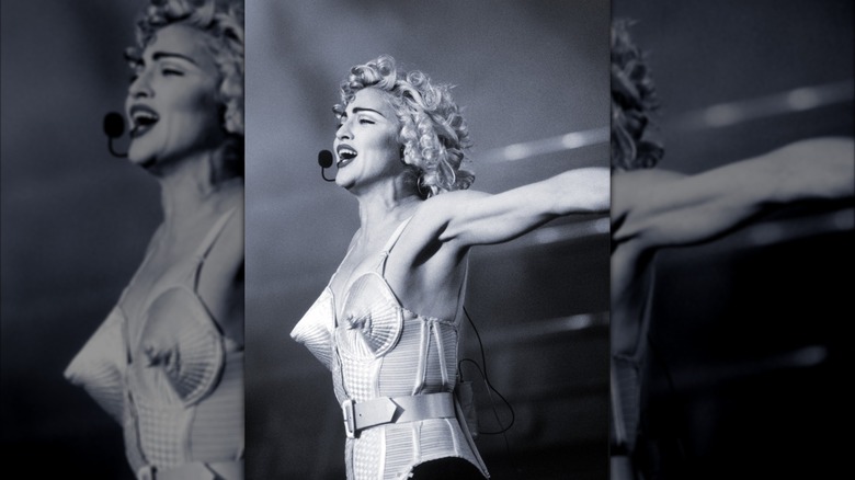 Black and white photo of Madonna in her iconic cone bra.
